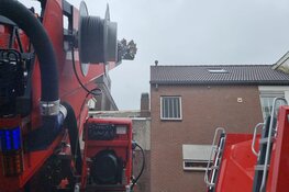 Schoorsteenbrand bij bedrijfspand in Zaandam